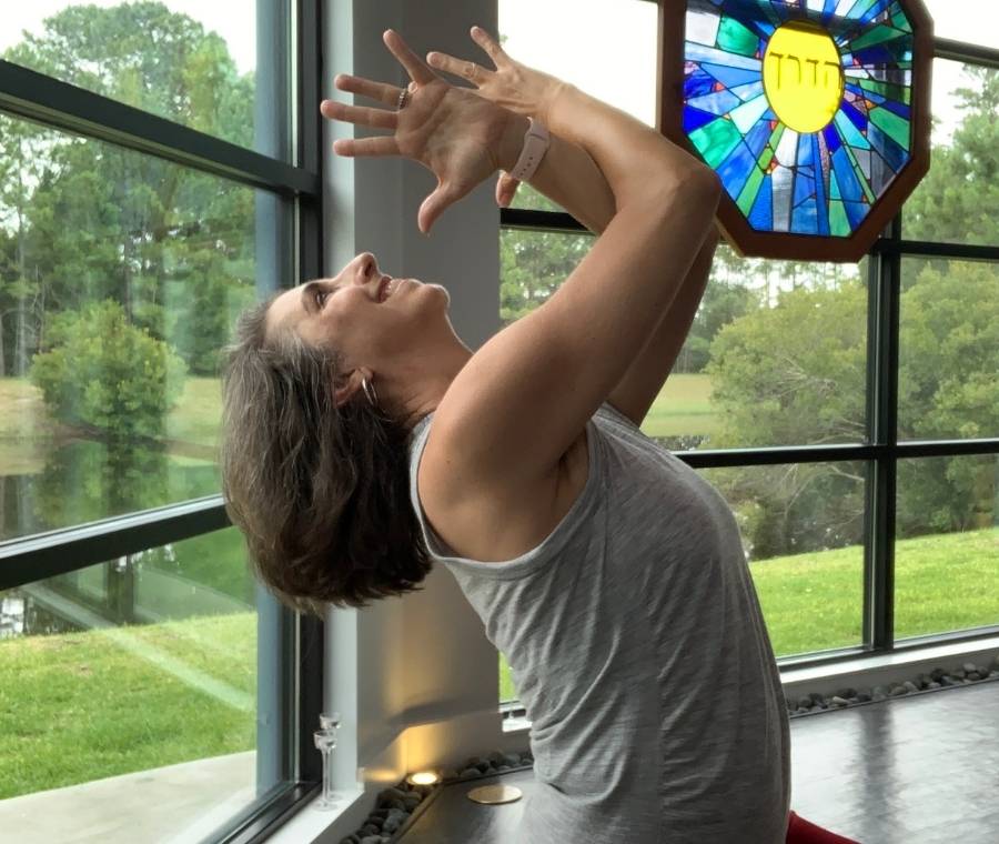 lisa long in a yoga therapy pose at mind body beyond center in jacksonville florida